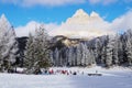 Tre cime di lavaredo and childrenskating on the iced Antorno lake