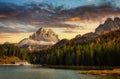 The Tre Cime di Lavaredo mountains (3003 m) and Lago di Misurina lake at sunset. Dolomites, South Tyrol. Italy Royalty Free Stock Photo