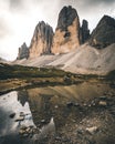 Tre cime di Lavaredo reflected from a lake, Dolomite Alps, Italy Royalty Free Stock Photo