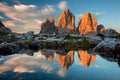 Tre Cime di Lavaredo with reflection in lake at sundown, Dolomites Alps