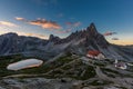 Tre Cime and rifugio hut before sunrise in summer, Tre Cime di Lavaredo National Park, Dolomites, Italy