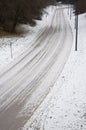 A treacherous looking road covered with snow Royalty Free Stock Photo