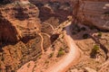 A treacherous road descends into a desert canyon. Royalty Free Stock Photo