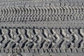 Tire tread marks in the sand Royalty Free Stock Photo