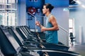 Treadmill, running and profile of man in gym for cardio workout and heart health. Fitness, sports and male runner on