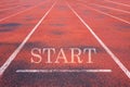 Treadmill at the stadium with a white imprint of the word START Royalty Free Stock Photo