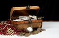 Treasure box on table with gold silver coins and bars Royalty Free Stock Photo