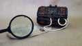 a treasure chest and an old map on a light next to a magnifying glass. there are pearls and shells in the box. search Royalty Free Stock Photo