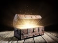 Treasure Chest - Open Ancient Trunk With Glowing Magic Lights Royalty Free Stock Photo