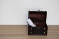Treasure chest with a rolled blank paper inside of it Royalty Free Stock Photo