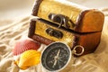 Treasure chest with seashells and compass Royalty Free Stock Photo
