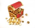 Treasure Coffer full of gold coins, some also outside Royalty Free Stock Photo