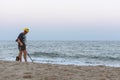 Treasure hunter with a metal detector