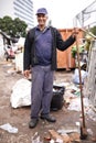 Treasure hunting at the dump. a man sorting through garbage at a dumping site. Royalty Free Stock Photo