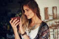 Treasure the little things. a free spirited young woman admiring a pot plant in her hands. Royalty Free Stock Photo