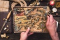 Treasure map in adventurer treasure hunter hands.