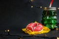 Treat for Santa and lightning garland on dark background Royalty Free Stock Photo