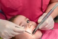 Treatment of baby teeth in a child, a little girl at the dentist, examination and treatment of teeth. Royalty Free Stock Photo