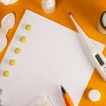 Treatment of colds and flu. Various medications, cold pills, throat spray, nasal drops, and a paper napkin on a orange background