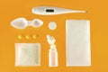 Treatment of colds and flu. Various medications, cold pills, throat spray, nasal drops, and a paper napkin on a white background.