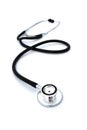 On a white isolated background lies a black stethoscope.