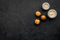 Treatment set with natural walnut scrub to take bath on dark background top view mock-up Royalty Free Stock Photo