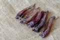 Treats for dogs. Five dried rabbit ears on burlap