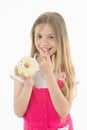 Treats for holidays. Kid rewarded for good behavior with sugary treats. Girl cute smiling face holds sweet donut. Girl Royalty Free Stock Photo