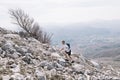 Trebinje, Bosnia and Herzegovina - Skyrunning race runner on rocky mountain ridge