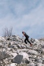 Trebinje, Bosnia and Herzegovina - Skyrunning race runner on rocky mountain ridge