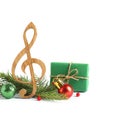 Treble clef with decorations  on white. Christmas music concept Royalty Free Stock Photo