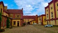 Old reconstructed brewery building with entrance into the storage backyard during nice summer weather Royalty Free Stock Photo