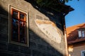 Trebon, South Bohemia, Czech Republic, 9 October 2021: Antique sundial on the facade of historic house, Colorful renaissance and