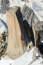 Tree alpinists ascend on cliff in Alps