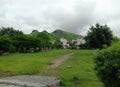 Tree and aravali hils and clouds in udaipur in bhuwana