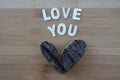 Tree bark heart and love you message with wooden letters Royalty Free Stock Photo