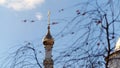 Tree branches on background of golden dome of church in autumn. Stock footage. Golden dome of christian church flaunts Royalty Free Stock Photo