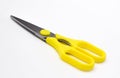 A large pair of scissors with yellow handles Royalty Free Stock Photo