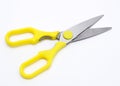 A large pair of scissors with yellow handles Royalty Free Stock Photo