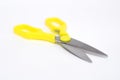 A large pair of scissors with yellow handles Royalty Free Stock Photo