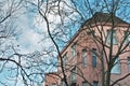 Tree branches in front of pink apartment building in Charlottenburg Berlin germany Royalty Free Stock Photo