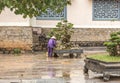 Tree care worker works at park in Vietnam Royalty Free Stock Photo