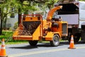 Wood chipper blowing tree branches cut A tree chipper or wood chipper is a portable machine used for reducing wood into smaller Royalty Free Stock Photo