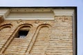 Tree crosses with window on brick wall against blue sky. Orthodox cross. Royalty Free Stock Photo