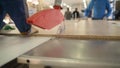 Tree design concept. Workers sawing a wooden panel at a furniture factory Royalty Free Stock Photo