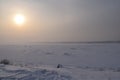 Winter sun over the earthy river. Winter landscape. Russia. Siberia. Royalty Free Stock Photo