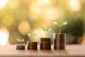 Tree growing on coin pile and blurred green nature background money growth concept. Royalty Free Stock Photo