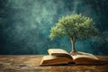 tree growing from an open book, symbolizing the growth of knowledge and ideas Royalty Free Stock Photo