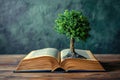 tree growing from an open book, symbolizing the growth of knowledge and ideas Royalty Free Stock Photo