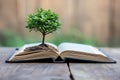 tree growing from an open book, symbolizing the growth of knowledge and ideas Royalty Free Stock Photo